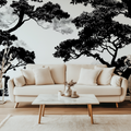 Black and white tree wallpaper creating drama in modern living room with grey sofa