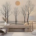 Minimalist tree wallpaper creating depth in a modern living room, black silhouettes against warm beige tones