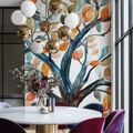 Watercolor tree mural wallpaper creating a cozy atmosphere in a modern living room with natural light
