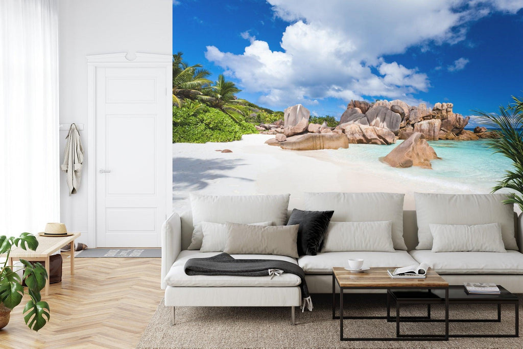 Beach scene wallpaper transforming a master bedroom into a peaceful coastal retreat