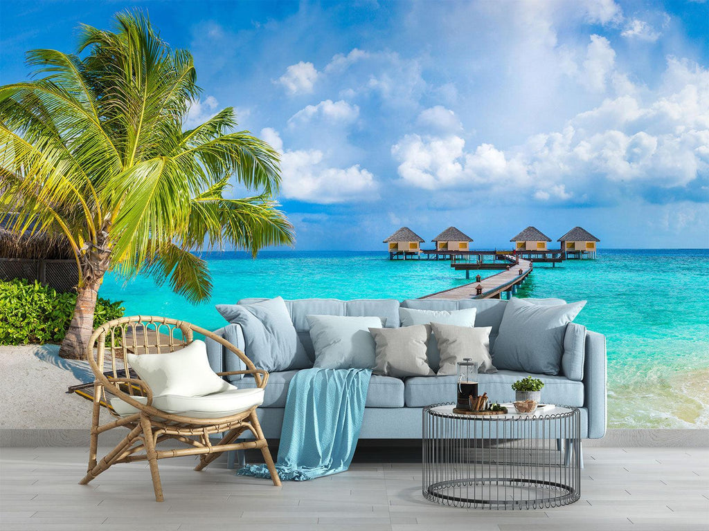 Tropical beach wallpaper creating a stunning focal point in a modern living room with white furniture