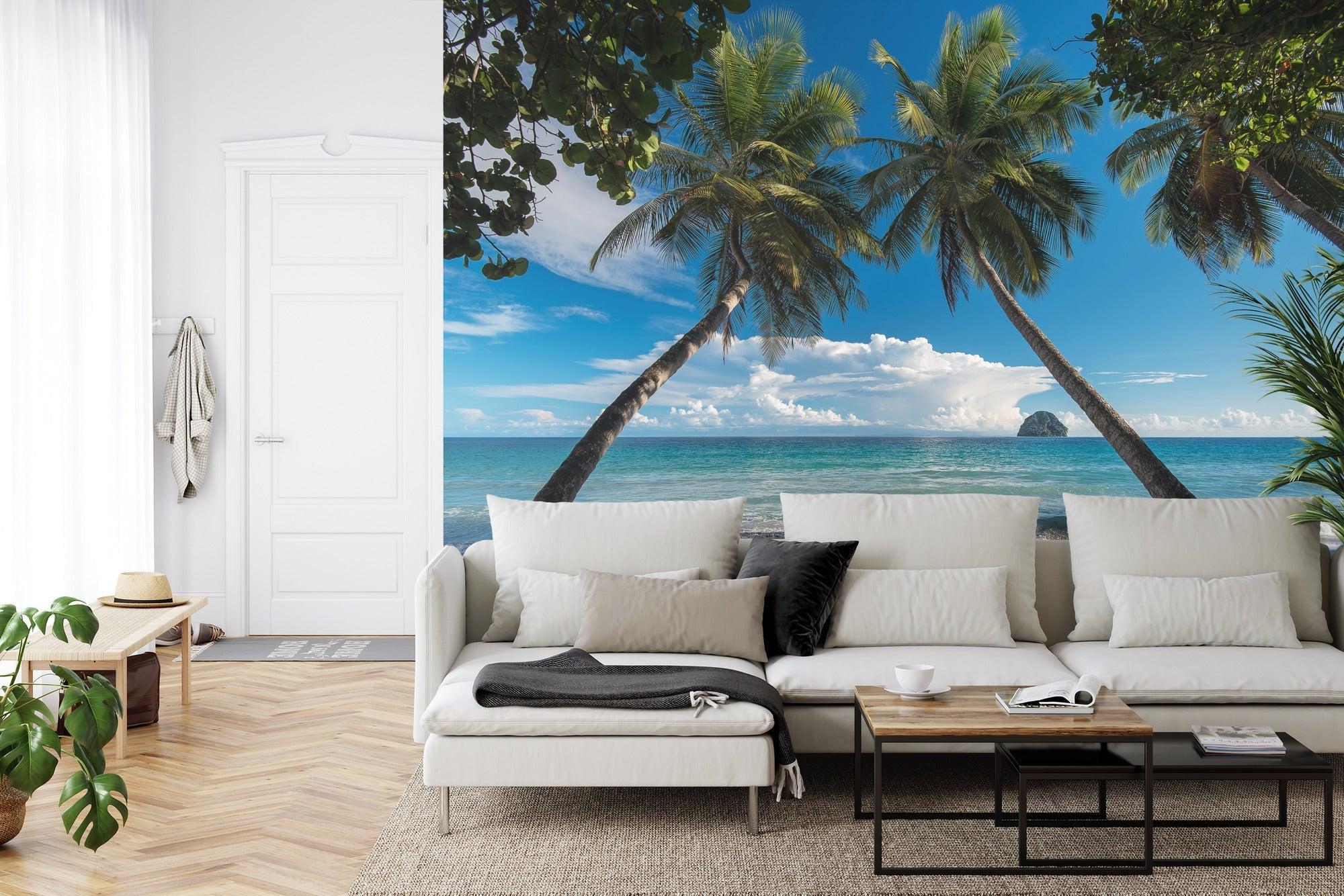 Beach scene mural wallpaper in master bedroom showing palm trees and ocean view