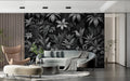Tropical birds wallpaper in modern living room showing black and white contrast against neutral furniture