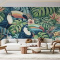 Tropical bird wallpaper with navy toucans and monstera leaves creating a stunning feature wall in a modern living room