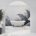 Tropical fern wallpaper in modern grey bathroom, gold accents catching morning light