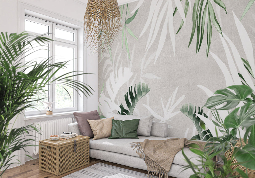 Tropical leaf wallpaper creating a fresh vibe in a modern living room with white furniture