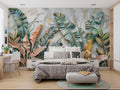 Tropical leaf wallpaper with gold accents in modern living room, creating a luxurious backdrop for gray sofa and brass accents