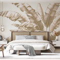 Beige Tropical Leaf Wallpaper bringing calm elegance to a modern living room with natural light and minimal furniture