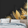 Black and gold tropical palm leaf wallpaper in modern living room with tall windows