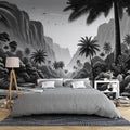 Black and white tropical mountain wallpaper mural creating depth in a modern minimalist living room with clean furniture