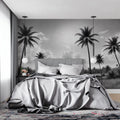 Black and white tropical beach wallpaper creating a calm atmosphere in a modern living room