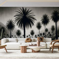 Black and white tropical palm grove mural wallpaper styled in modern living room with minimal furniture