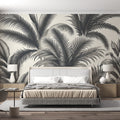 Black and white tropical palm leaf wallpaper creating a stunning focal point in a modern minimalist living room