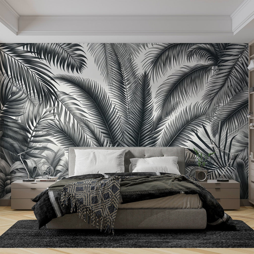 Black and white palm leaves wallpaper creating a modern statement wall in a bright living room setting