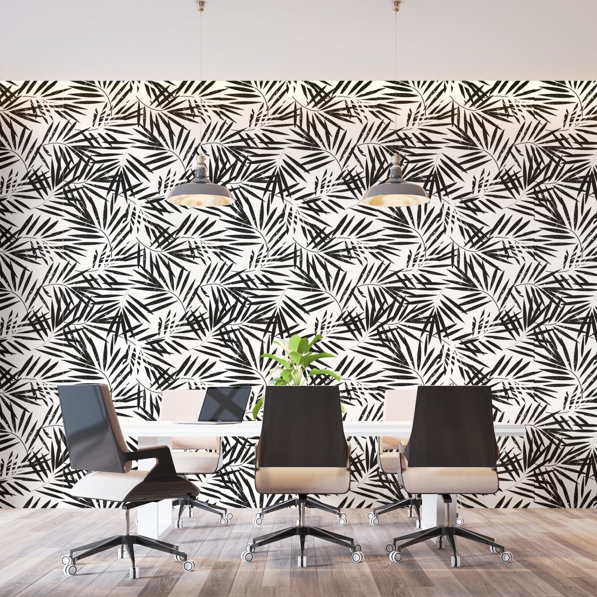 Black and white tropical palm leaf wallpaper creating a modern statement wall in a bright living room setting