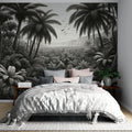 Black and white tropical palm wallpaper creating a dramatic statement wall in a modern living room with minimalist furniture