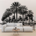 Black and white tropical palm tree wallpaper creating a stunning focal point in a modern living room with minimalist furniture
