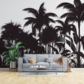 Tropical palm tree silhouette wallpaper creating drama in a modern living room with white sofa and minimal decor