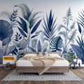 Blue Monstera leaf wallpaper creating a fresh tropical statement in a modern living room with white furniture