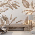 Tropical banana leaf wallpaper in beige creating a calm and sophisticated atmosphere in a modern living room