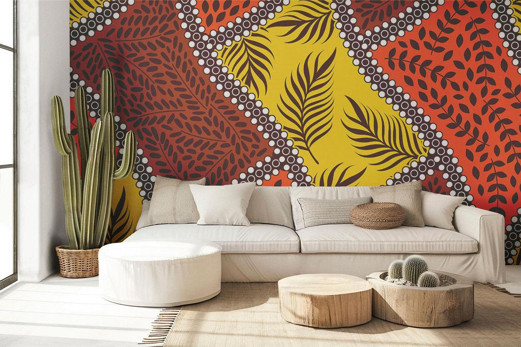 Tropical geometric leaf wallpaper brightening a modern living room with orange and yellow tones