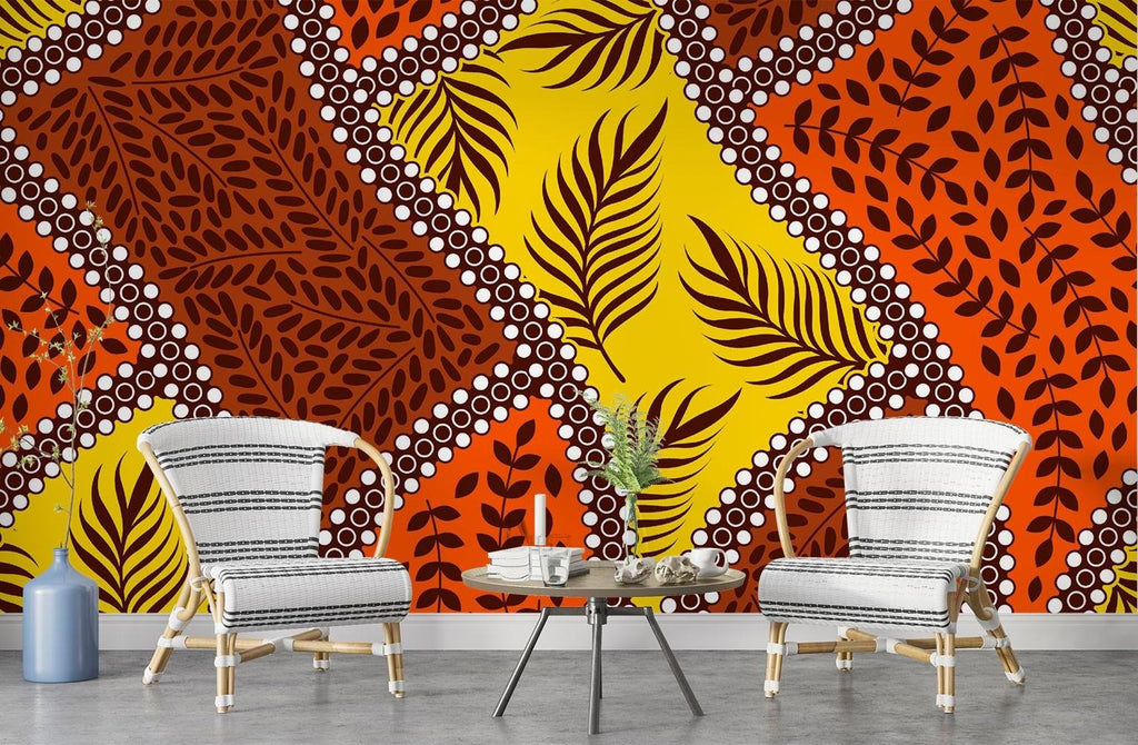 Orange and yellow tropical leaf wallpaper creating warmth in a bedroom setting