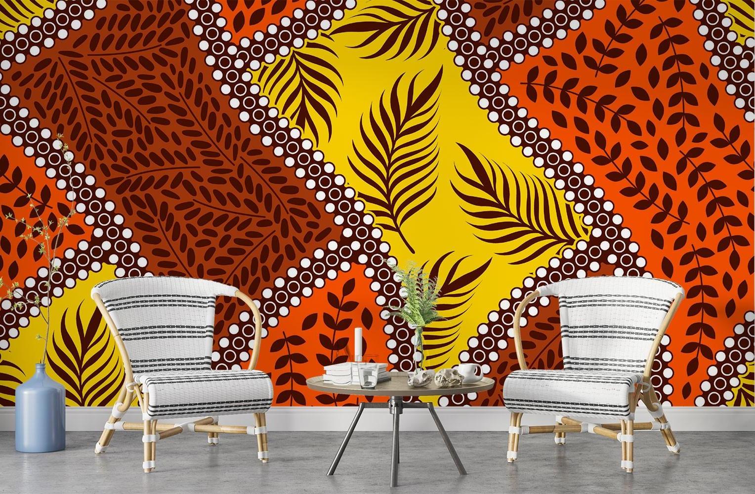 Orange and yellow tropical leaf wallpaper creating warmth in a bedroom setting