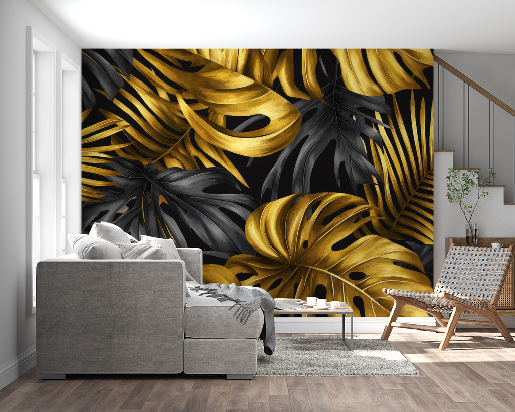 Tropical black and gold Monstera wallpaper in modern living room with grey sofa and natural light
