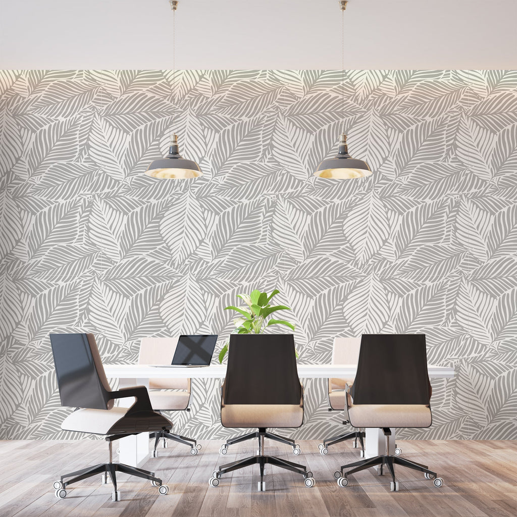 Tropical leaf wallpaper in grey tones brightening up a minimalist bedroom space