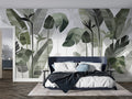 Tropical leaf wallpaper creating a fresh garden feel in a modern living room with white furniture