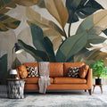 Tropical monstera leaf wallpaper creating a fresh atmosphere in a modern living room with golden accents