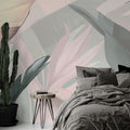 Tropical leaf wallpaper with pink and sage palm leaves creating a serene atmosphere in a modern living room
