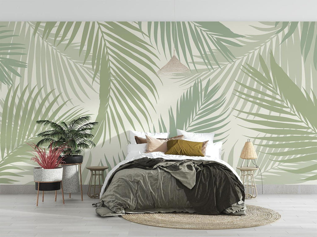 Sage green palm leaves wallpaper bringing natural beauty to a minimal bedroom setting