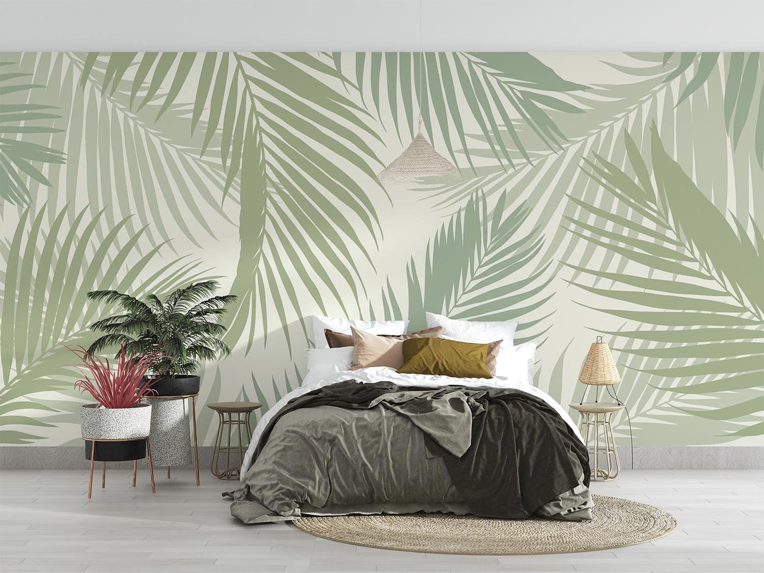 Sage green palm leaves wallpaper bringing natural beauty to a minimal bedroom setting