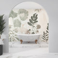 Botanical leaf wallpaper creating a calm atmosphere in a modern living room with natural light