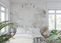 Tropical palm leaf wallpaper in modern living room showing soft beige and grey tones