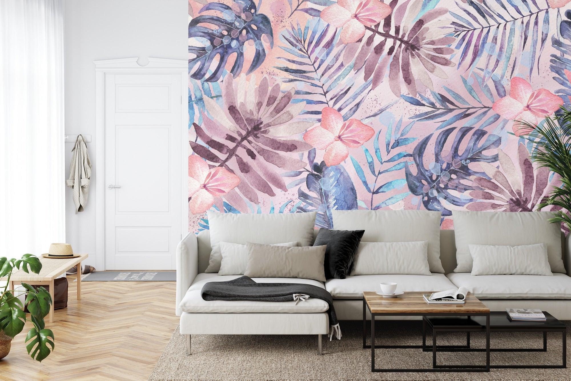 Tropical wallpaper with pink flowers and monstera leaves in a bright modern living room
