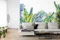 Tropical leaf wallpaper creating a fresh mood in modern living room with white furniture