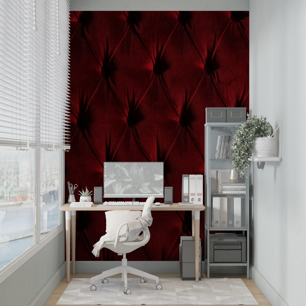 Luxury hotel lobby showcasing tufted burgundy wallpaper with spot lighting
