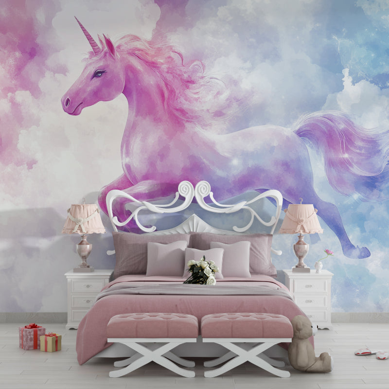 Pink and purple unicorn mural wallpaper in a cozy nursery setting with rocking chair