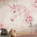 Unicorn wall mural in a bright girl's bedroom, showing pink floral fantasy design with soft lighting