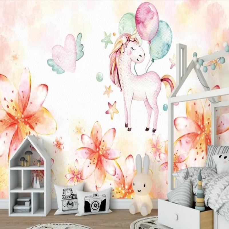Kids playroom with unicorn fantasy wallpaper, highlighting the whimsical floral details