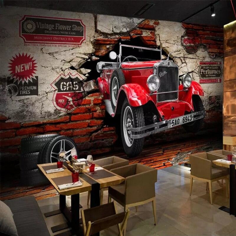 Vintage car wallpaper creating dramatic effect in modern living room with red classic automobile breaking through brick wall