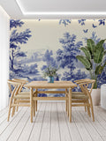 Blue Toile de Jouy wallpaper in a bright living room with French country furniture