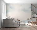 Watercolor landscape mural in modern Scandinavian living room with minimal furniture