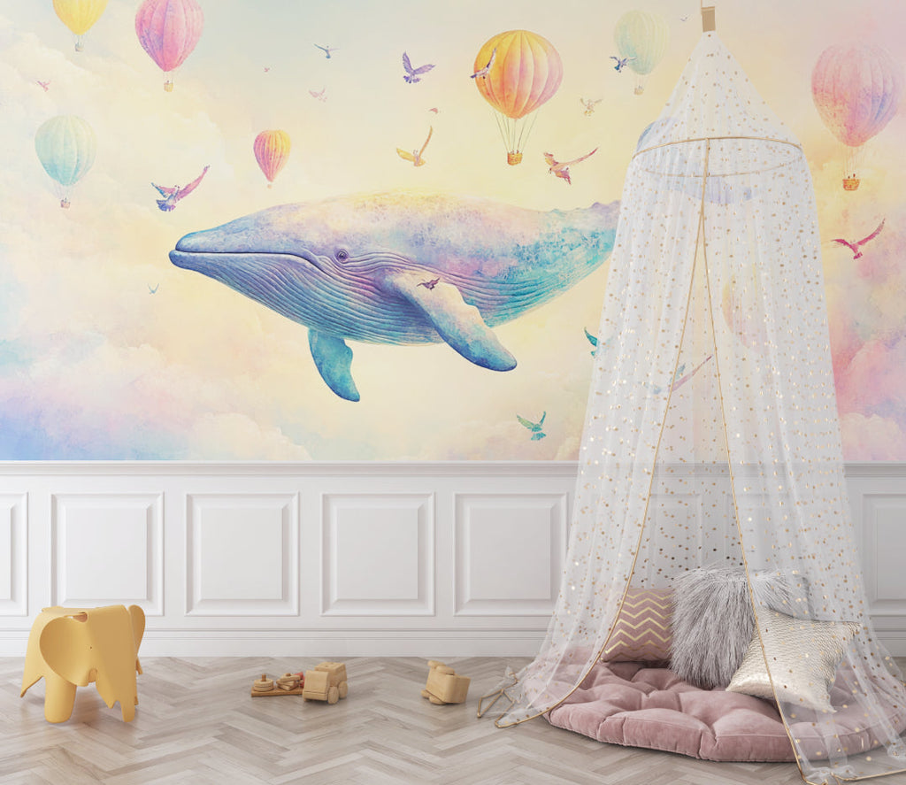 Reading nook with marine theme wallpaper showing dreamy whales and colorful hot air balloons