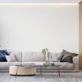 Modern white wallpaper in bright living room setting with minimal furniture and large windows