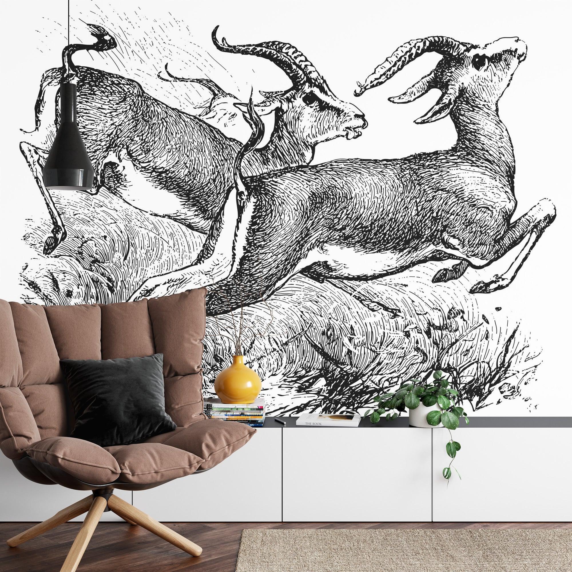 Black and white gazelle sketch mural adding drama to dining room with wooden table and pendant lights